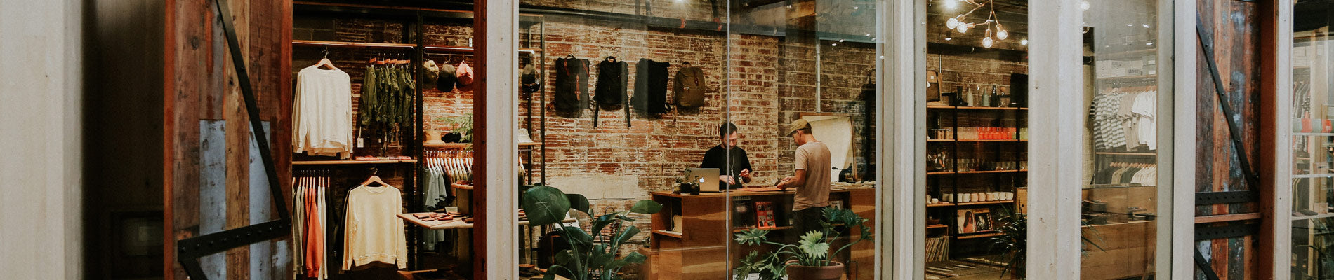 Rustic brick shop with Carhartt WIP apparel, workwear jackets, and rugged essentials in earthy tones.