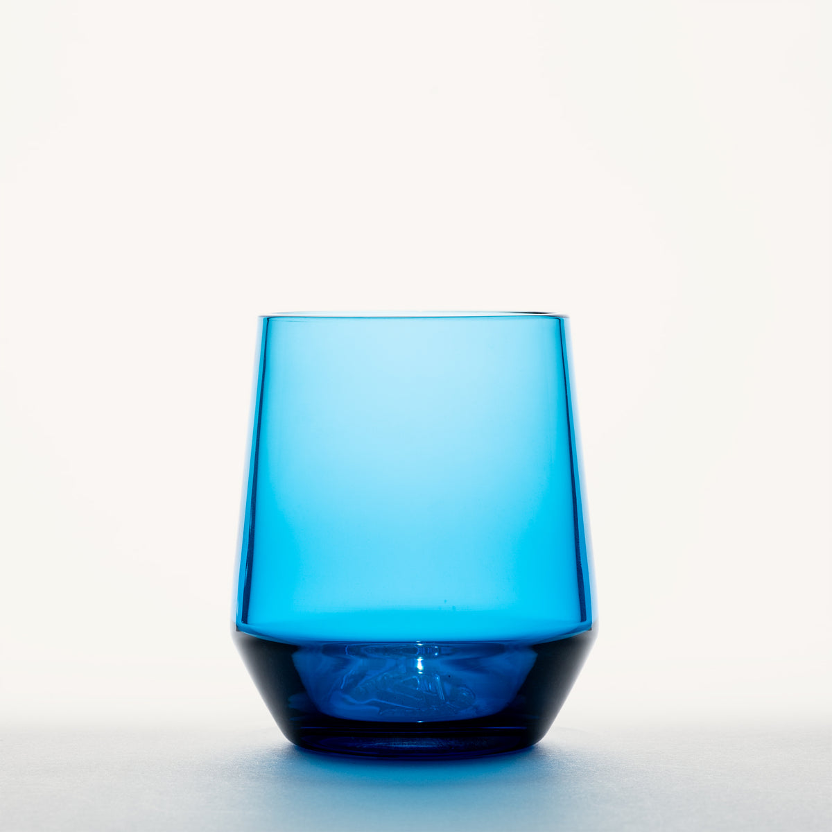 Blue stemless wine glass with a thick, darker base, shown from the front against a white background.