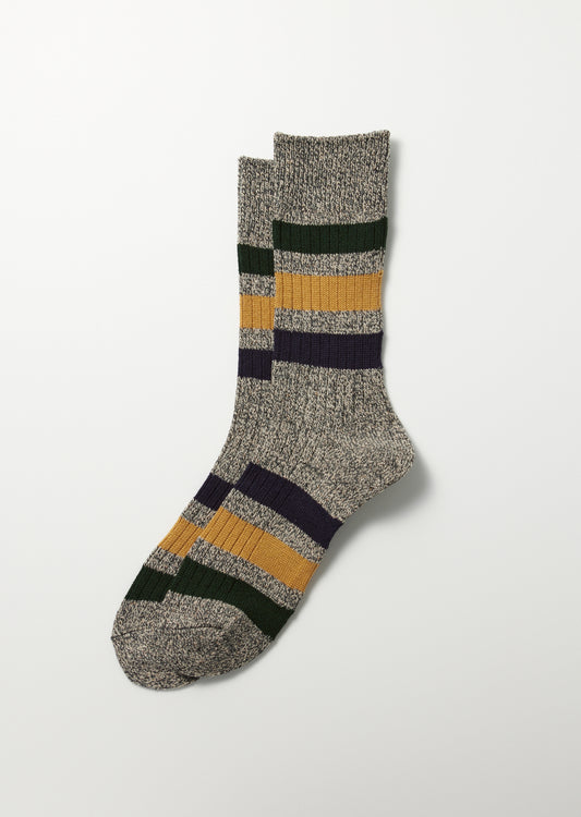Pair of marled grey crew socks with green, yellow, and navy stripes.