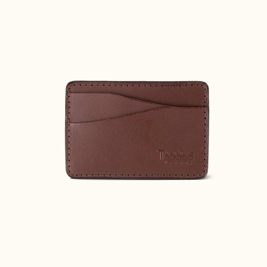 Cognac leather money clip wallet by Tanner Goods with multiple card slots and stitched edges.