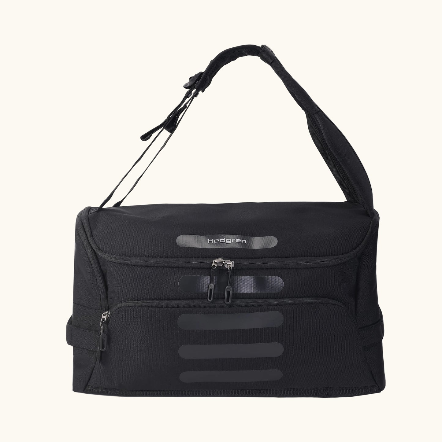 A green Hedgren Sojourn duffle bag with multiple compartments and a rolled-up design, featuring a shoulder strap and a top handle.