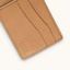 Stone grey utility bifold wallet with smooth leather texture, folded, showing subtle creases.