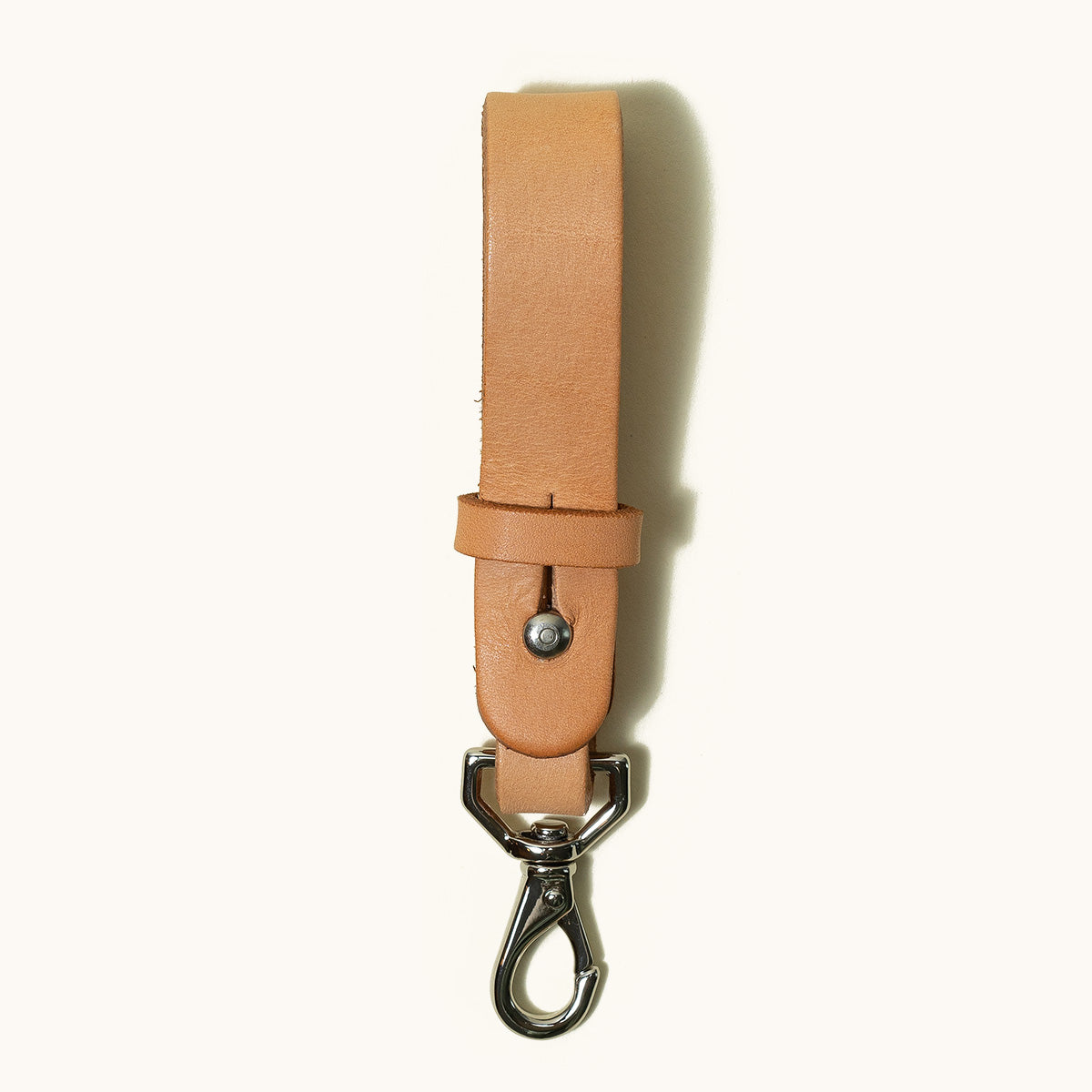 Natural leather Key Lanyard with a silver swivel clasp on a white background.