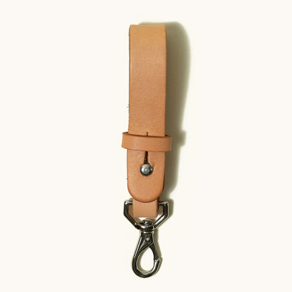 Natural leather Key Lanyard with a silver swivel clasp on a white background.