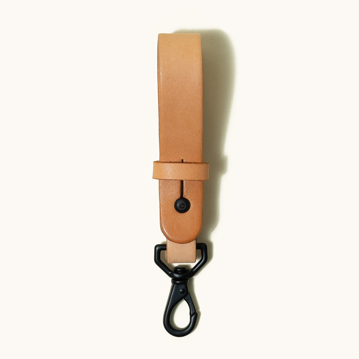 Vertical natural leather Key Lanyard with a black swivel snap hook.