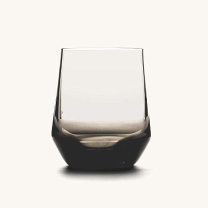 Stemless wine glass with a clear upper bowl and a dark, smoky faceted base.