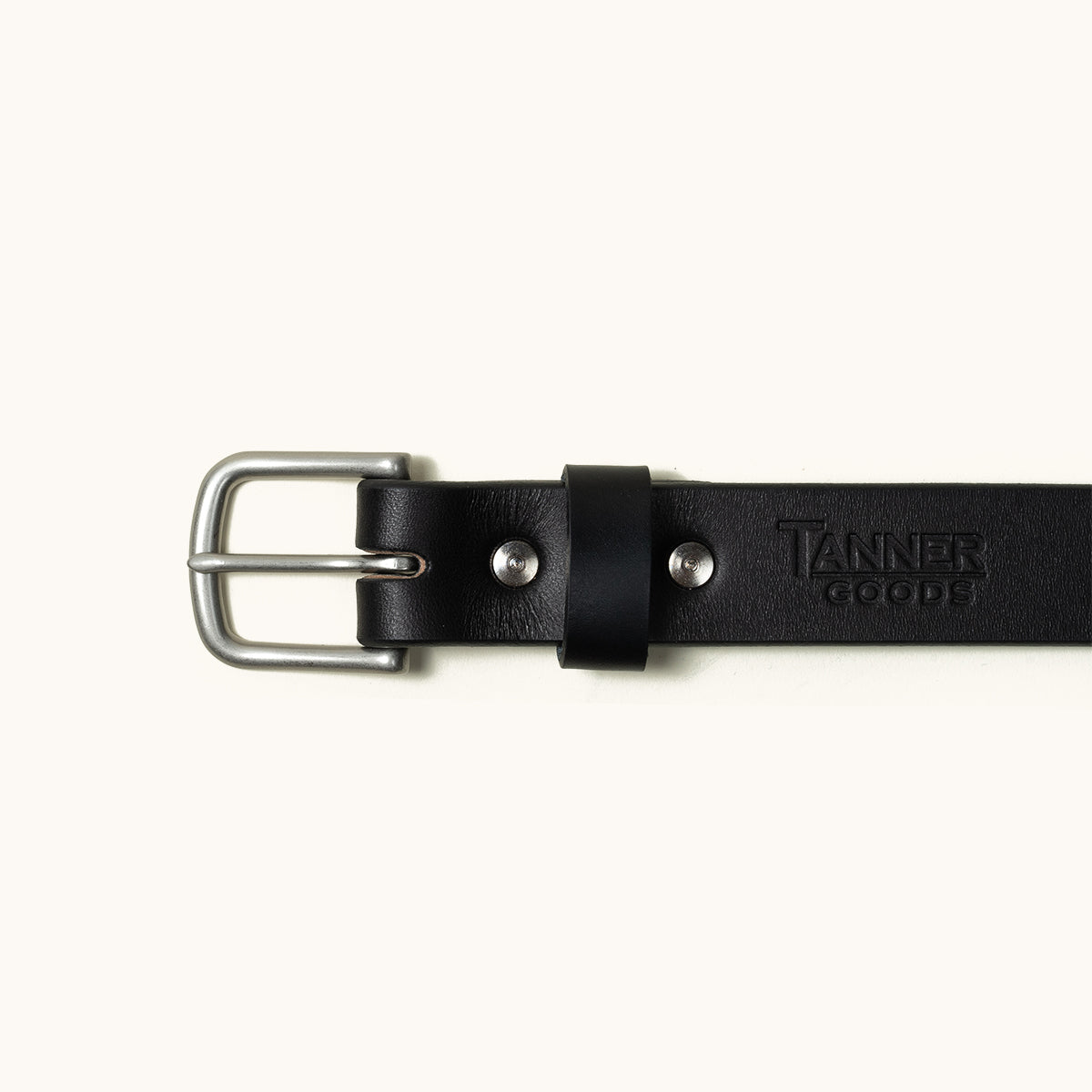 Black leather classic belt by Tanner Goods with a silver-toned buckle and embossed branding.