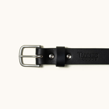 Black leather classic belt by Tanner Goods with a silver-toned buckle and embossed branding.