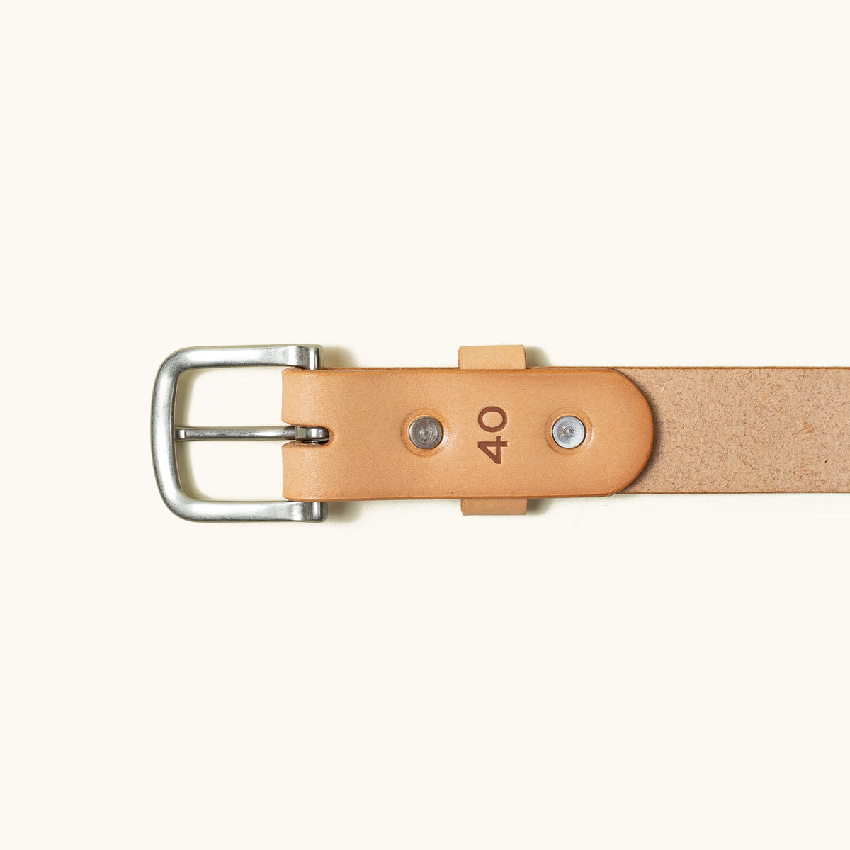 Classic natural tan leather belt with a silver buckle, two rivets, a leather keeper, and '40' embossed.