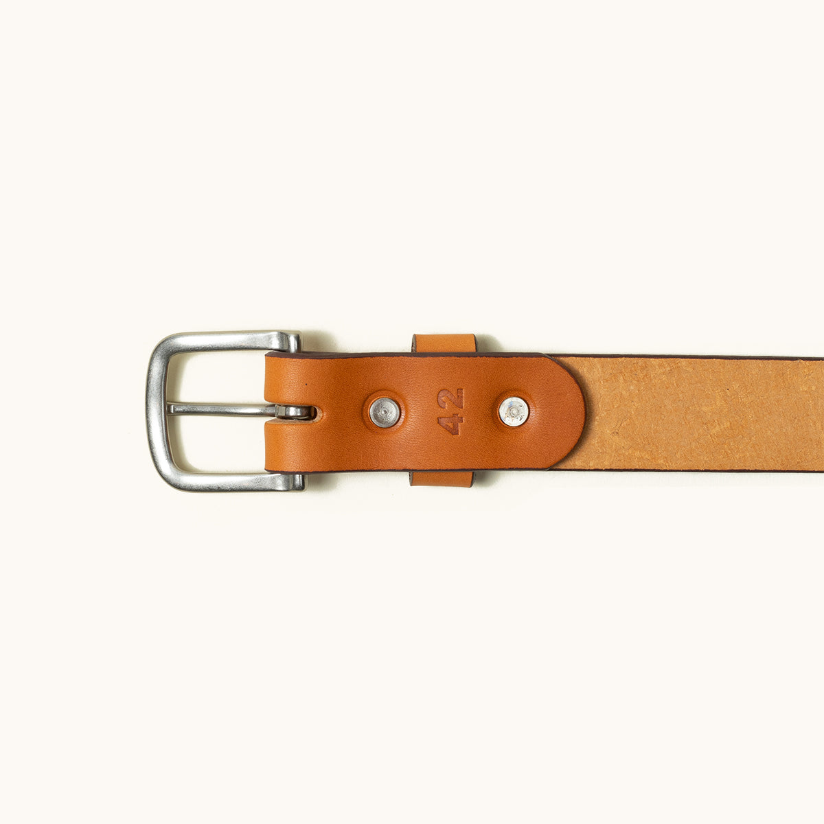 Saddle Tan Classic Belt made of smooth leather with a silver-toned metal buckle and the number 42 stamped near the buckle.