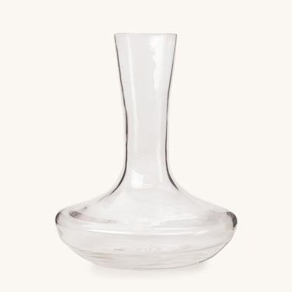 Clear glass decanter with a wide, rounded base and a tall, slender neck.