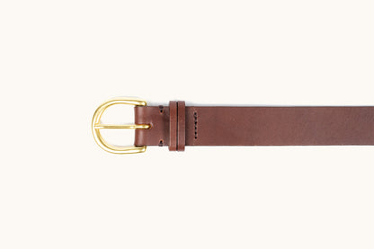 Cognac brown leather belt with a gold-tone D-shaped buckle and stitched details.