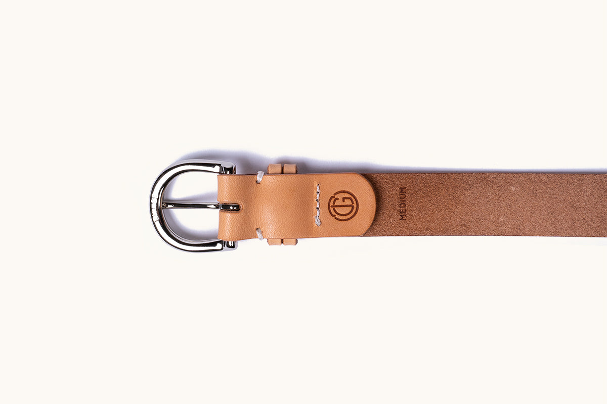 Natural leather belt with a silver buckle, debossed circular logo, and 'MEDIUM' text.