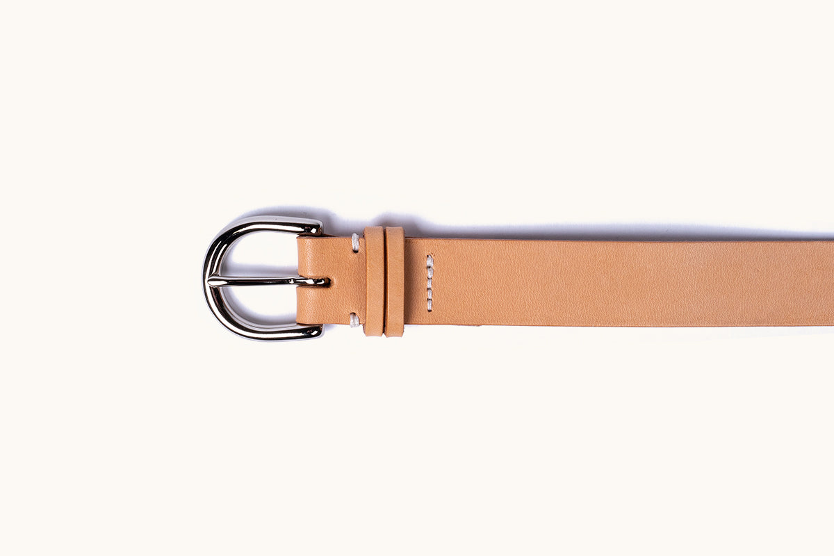 Natural leather Meridian belt with a silver-toned rounded buckle and white stitching.