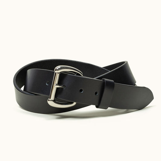 A coiled black belt with a stainless roller bar belt buckle.