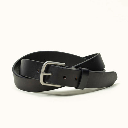 Black classic leather belt with a silver-toned metal buckle, coiled on a white background.