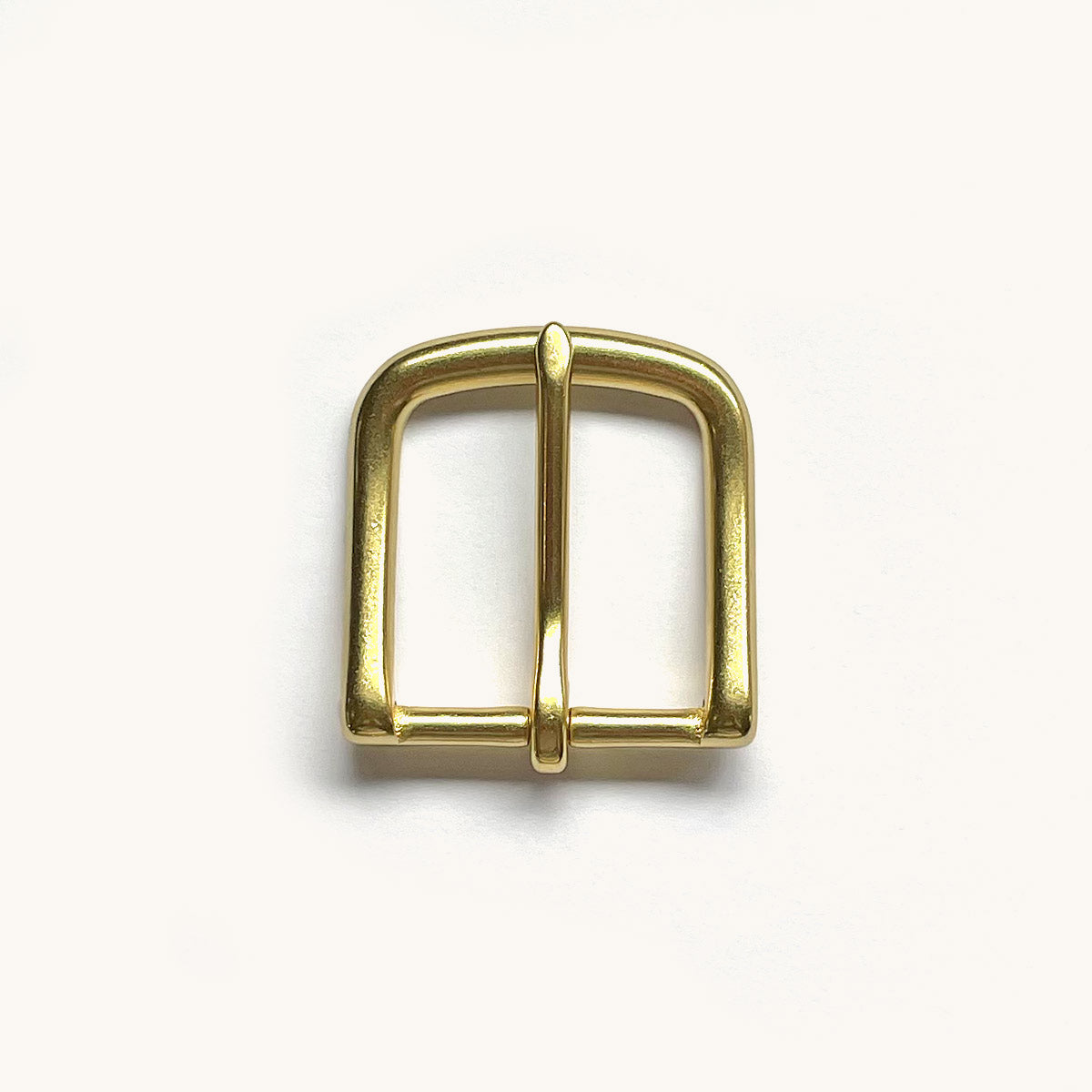 Polished brass roller buckle for a Classic Belt, shown from above on a white background.
