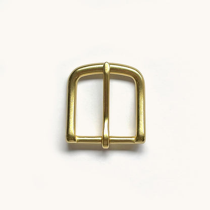 Shiny brass-toned belt buckle with a rounded rectangular frame and single prong, viewed from above.