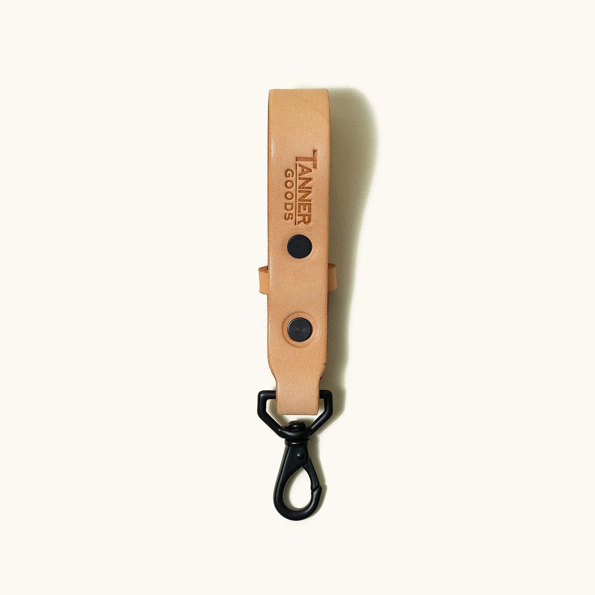 Natural leather Key Lanyard by Tanner Goods with black snaps and a matching swivel hook.
