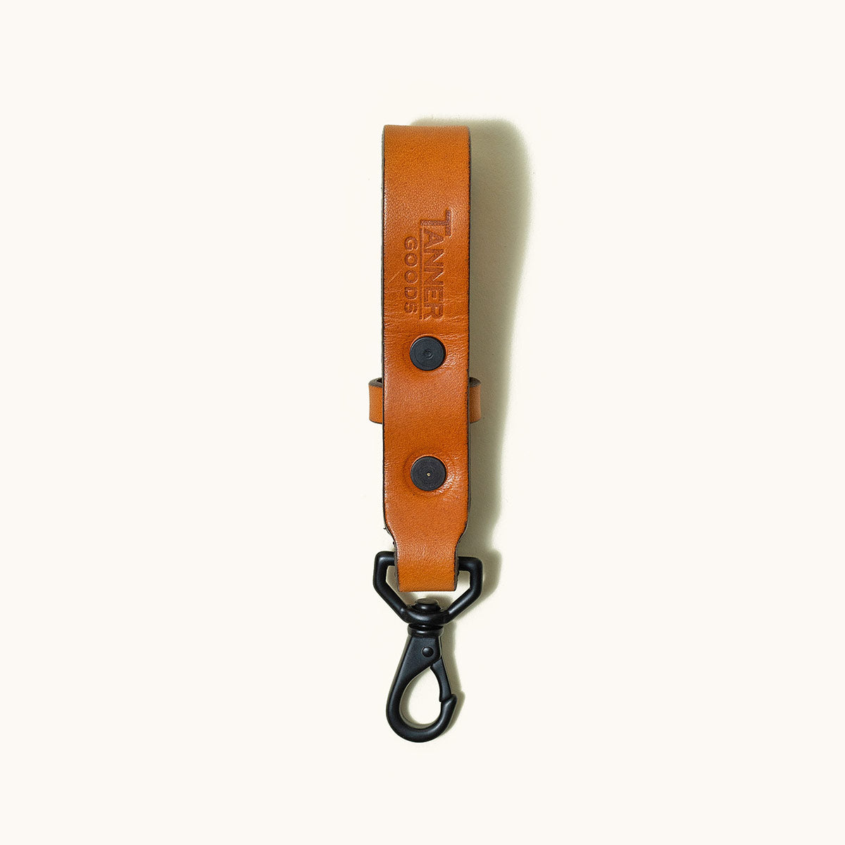 Saddle tan leather Key Lanyard by TANNER GOODS with black hardware and carabiner clip.