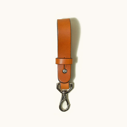 Saddle Tan leather Key Lanyard with a silver-toned D-ring and carabiner clip.
