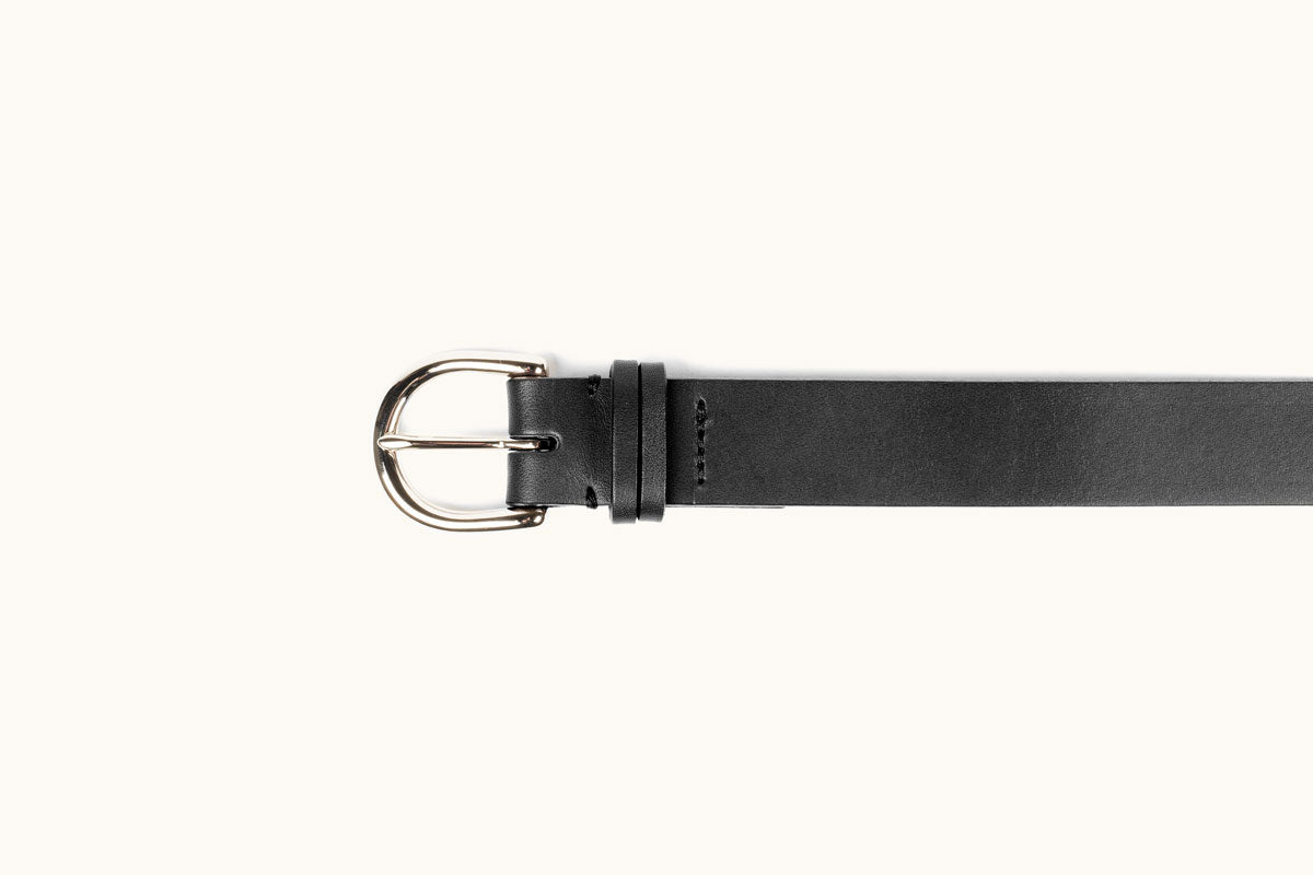 Black leather belt with a silver-tone D-ring buckle, styled horizontally on a white background.