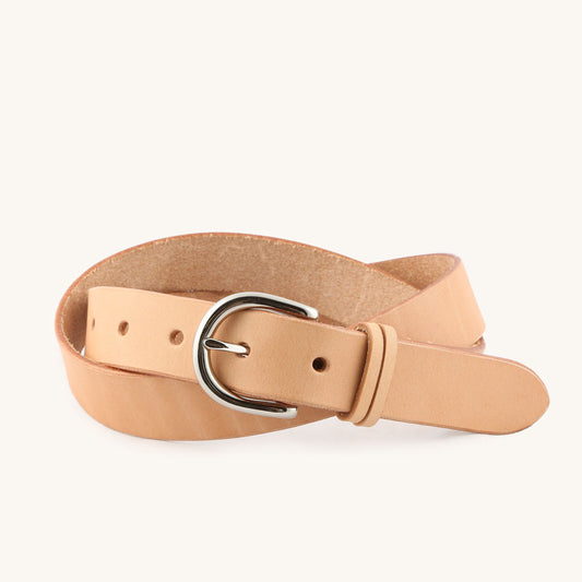Natural leather Meridian Belt with a silver-toned buckle, coiled on a white background.