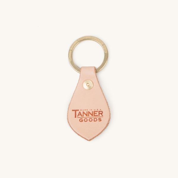 Natural leather key fob by Tanner Goods, featuring a brass keyring and 'Made in USA TANNER GOODS' logo.