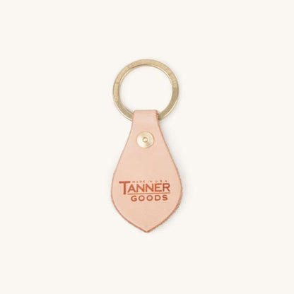 Natural leather key fob by Tanner Goods, featuring a brass keyring and 'Made in USA TANNER GOODS' logo.