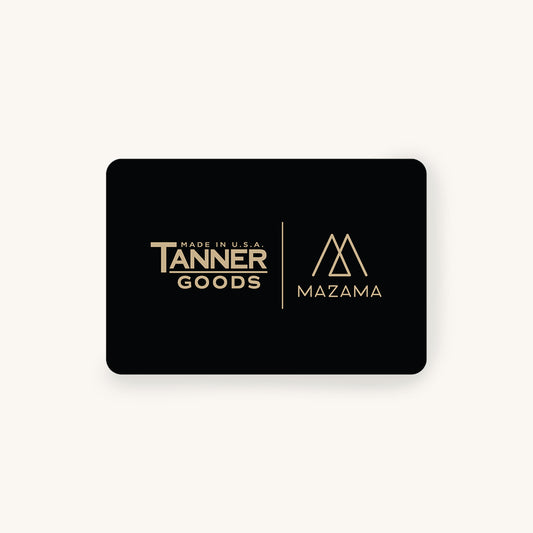 Black gift card featuring 'Tanner Goods' and 'Mazama' gold logos and text, centered with a subtle shadow.