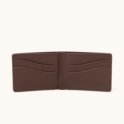 Cognac recycled leather utility bifold wallet, open to reveal multiple card slots and a bill compartment.