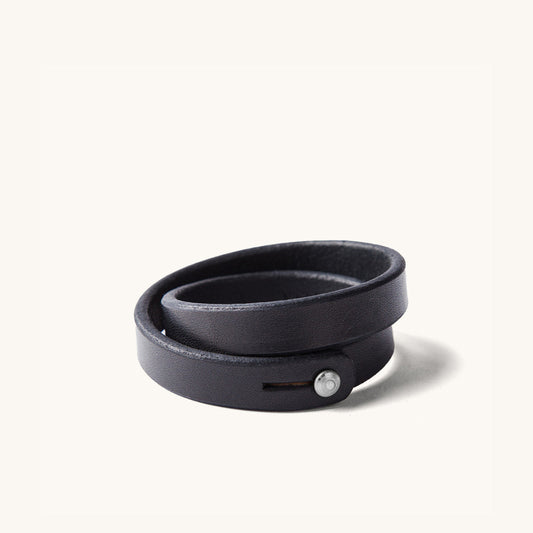 A double wrap black leather wristband with metal closure.