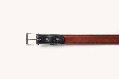 the underside of a size 34 black dress belt with a tanner goods monogram