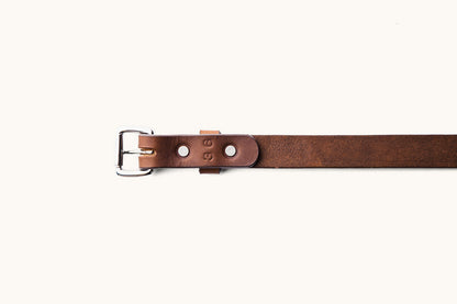 the underside of a size 36 brown leather belt with silver hardware