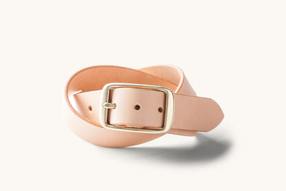 a coiled leather belt with cast brass buckle
